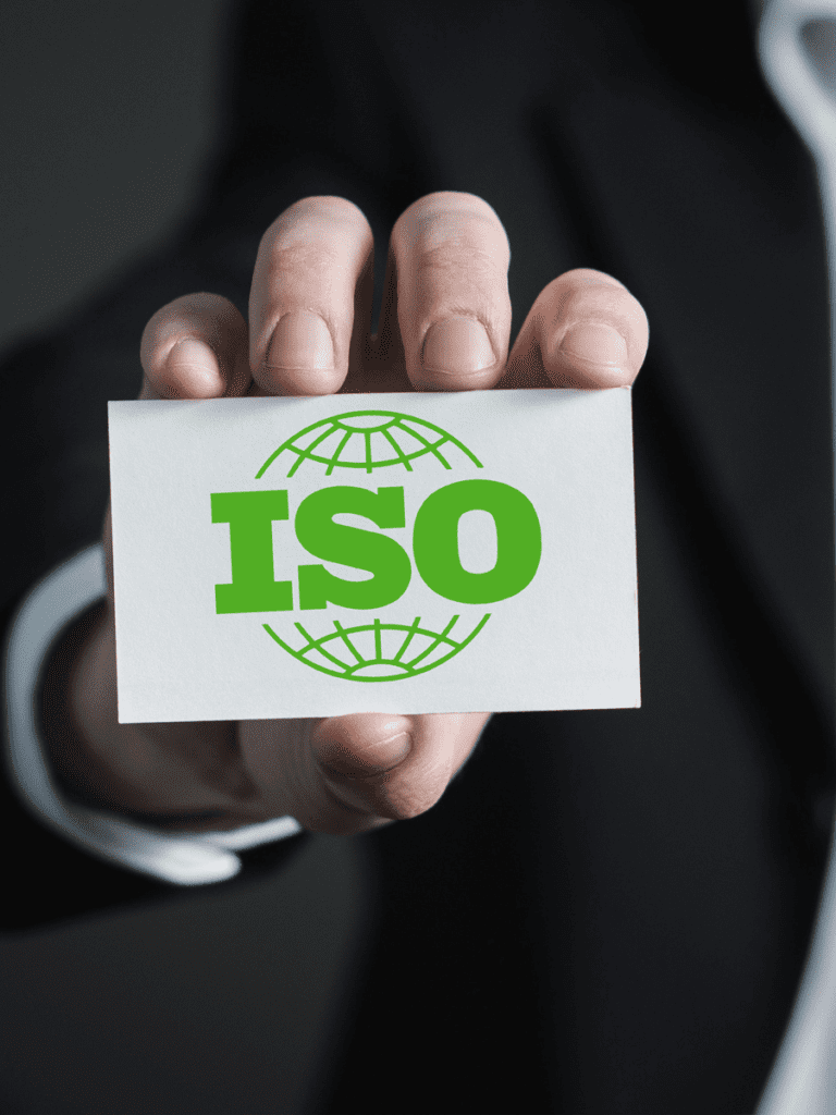 hand holding card with green ISO certification logo